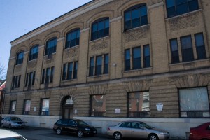 Originally home to Bell Canada's central offices, the building at the southeast corner or Oxford and Bellevue is now home to Precision Vacuum Products. Photo by Liz Gallin, 2013.